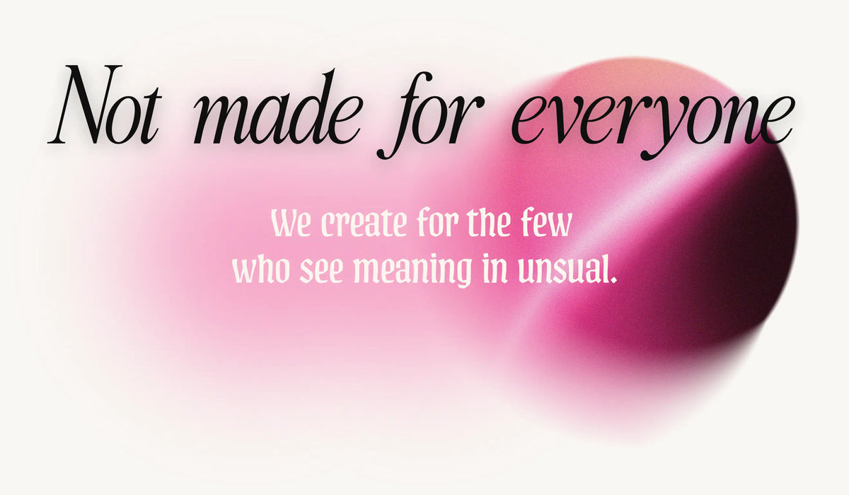 Pink lip gloss with text 'Not made for everyone' and 'We create for the few who see meaning in unusual.'